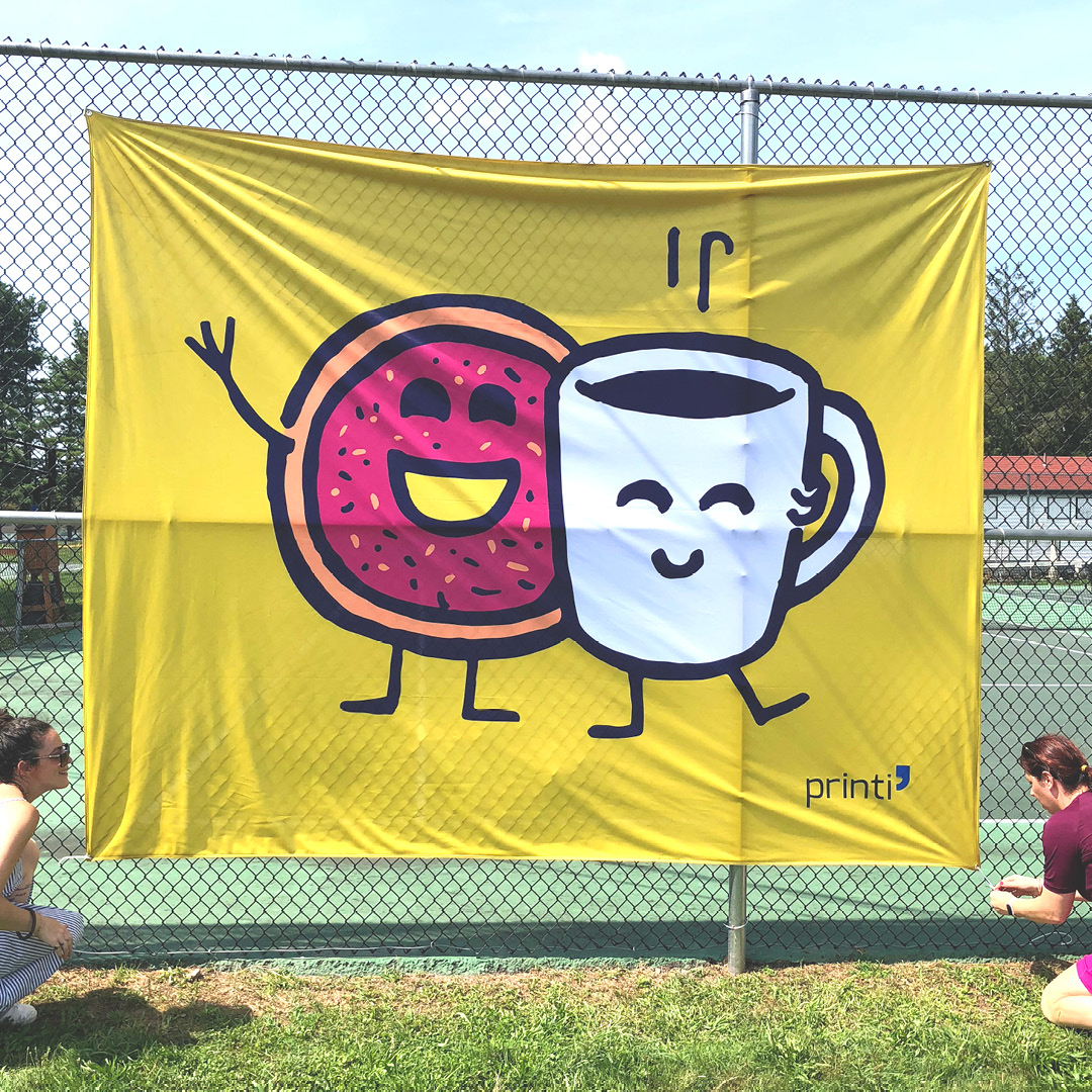 smiling mug and donut on a large flag