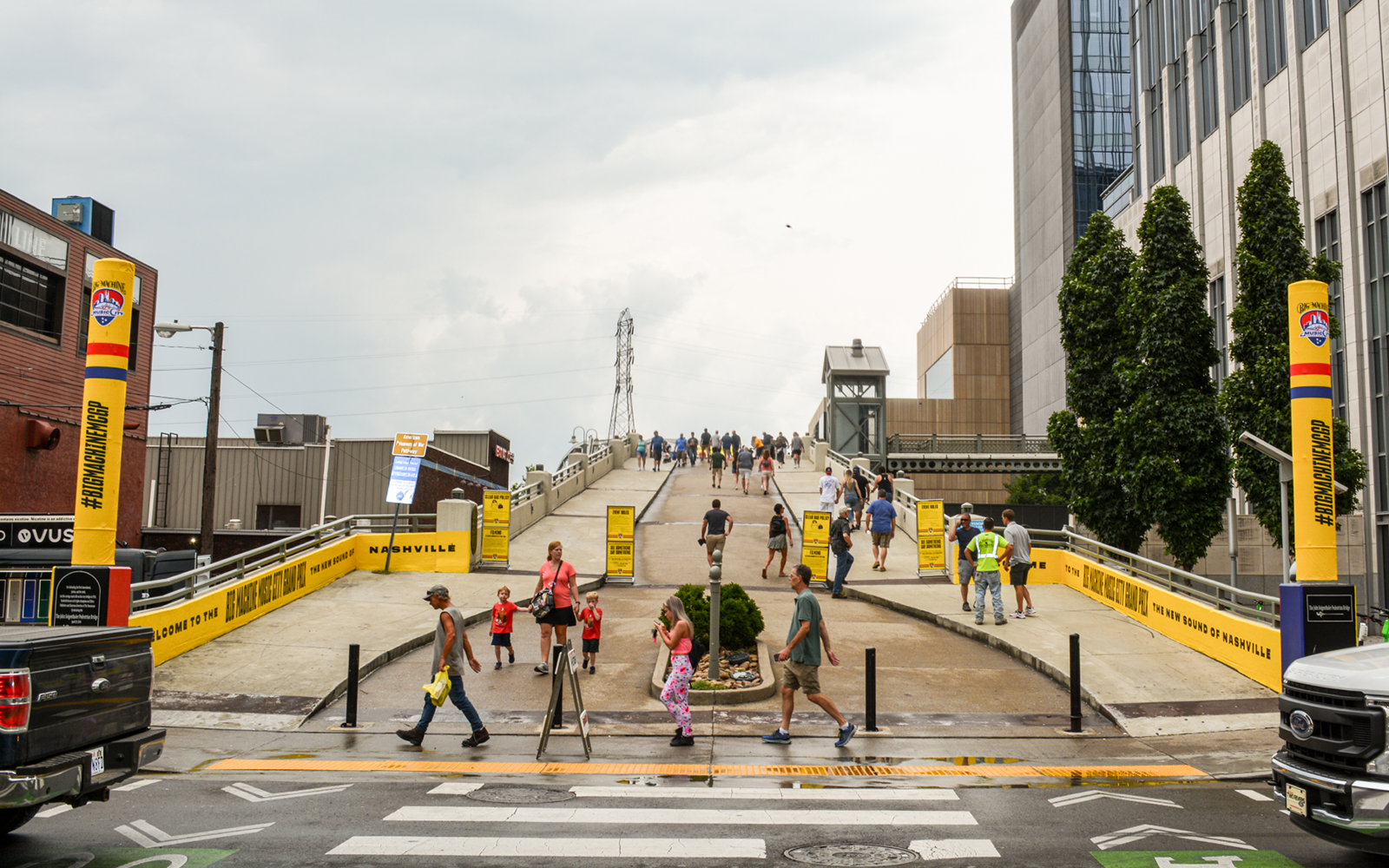 bright yellow wraps branding the entrance to the pedestrian bridge for the inaugural year